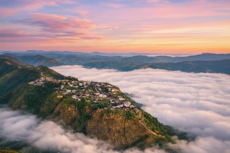 Soft light over quiet mountain ridges and a sea of clouds