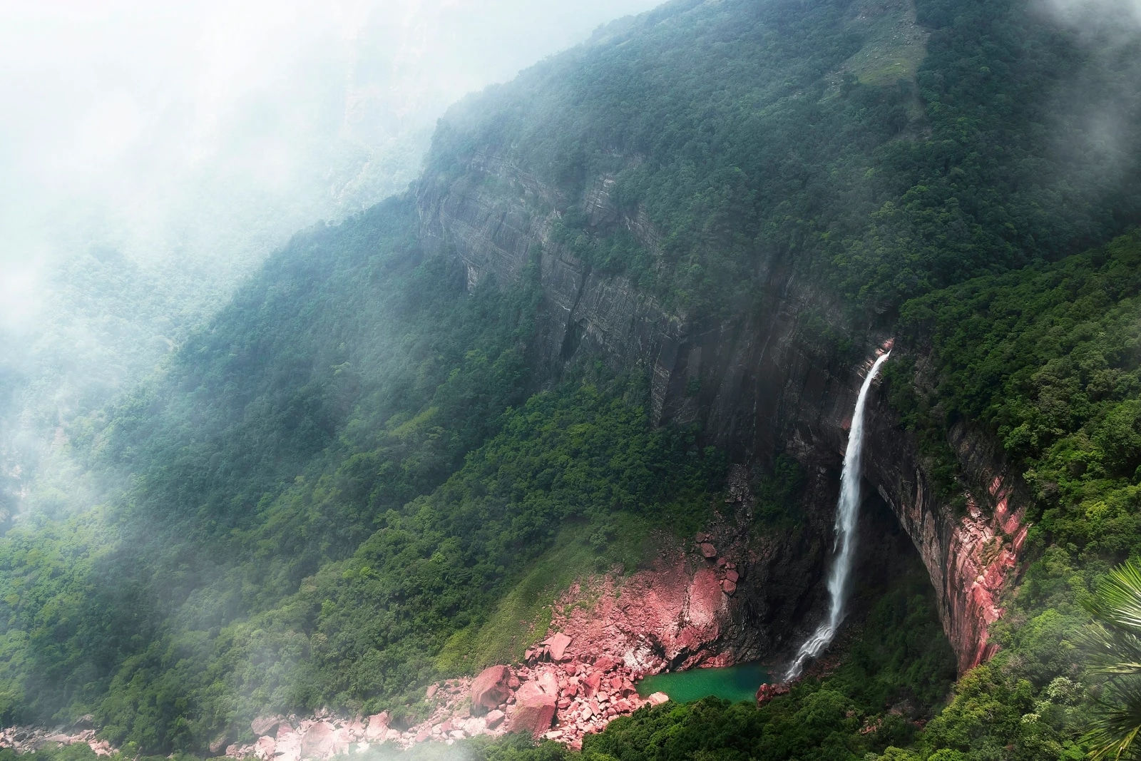 Nohkalikai Falls dropping into the misty green cliffs of Meghalaya