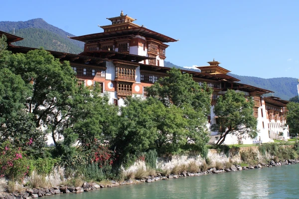 Punakha Dzong beside the river beneath clear blue skies in Bhutan